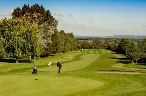 person playing golf on a golfing field