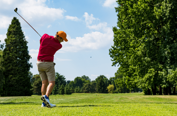 Close up Golfer is driving golf ball to green course